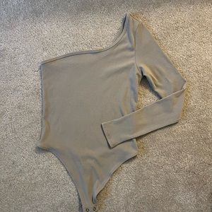 NWT tan one sleeved body suit